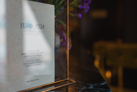 Elegant Menu Display with EURO 2024 Special Offers in Luxury Setting
