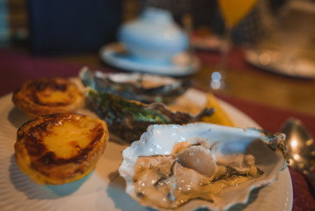 Luxurious Dining Experience with Gourmet Oysters and Custard Tarts