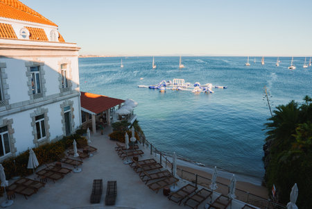 Luxurious Mediterranean Seaside Hotel with Floating Water Park and Sailboatsの写真素材