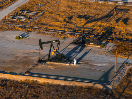 Aerial View of Oil Rigs and Pumpjacks in California Desertの写真素材