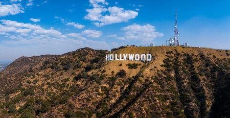 Iconic Hollywood Sign on Los Angeles Hills with Communication Towerの写真素材