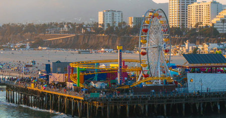 Santa Monica Pier with Ferris Wheel and Cityscape in Californiaの写真素材