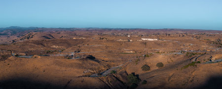 Aerial View of Oil Rigs in the Arid Desert Landscape of Californiaの写真素材