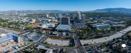 Aerial View of Reno, Nevada with Urban Landscape and Mountainsの写真素材