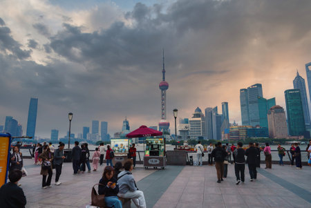 Bustling Scene at the Bund with Oriental Pearl Tower in Shanghaiの写真素材