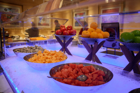 Vibrant Buffet with Fresh Fruits and Blue Lighting in Shanghaiの写真素材