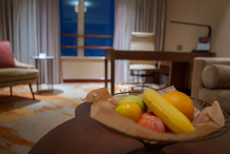 Luxurious Room Interior with Fruit Bowl and Floor to Ceiling Windowsの写真素材