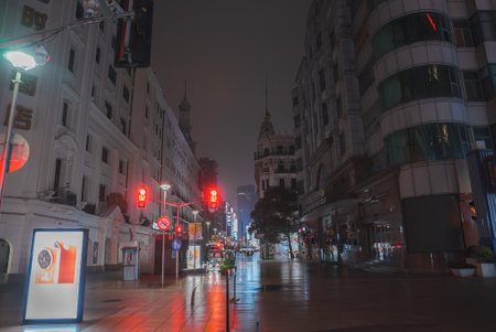 Nighttime Street Scene in Shanghais Bund with Historic Architectureの写真素材