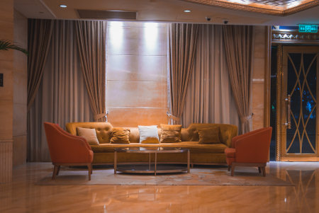 Elegant Interior with Mustard Sofa and Orange Armchairs in Shanghaiの写真素材