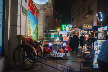 Vibrant Nighttime Street Scene in Shanghai with Vintage Car and Rickshaw