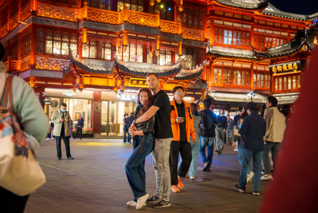 Traditional Chinese Building with Crowd in Shanghai at Nightの写真素材
