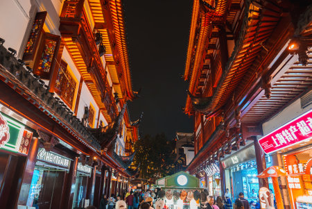 Vibrant Night Scene in Shanghais Old Town with Illuminated Eavesの写真素材