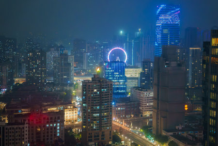 Vibrant Nighttime Cityscape of Shanghai with Illuminated Skyscrapersの写真素材