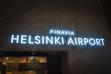 Illuminated Finavia Helsinki Airport Sign at Night in Finlandの写真素材