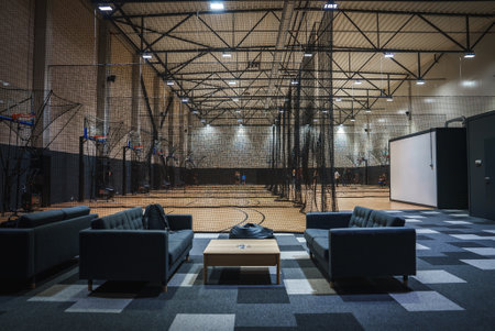 Indoor Basketball Facility with Multiple Courts and Seating Area