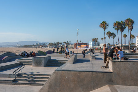 Skaters Performing Tricks at Venice Beach Skatepark in Los Angelesの写真素材