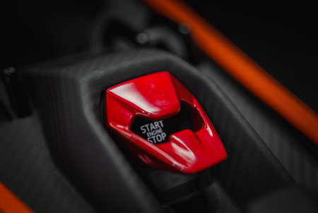 Close up of a red start-stop engine button