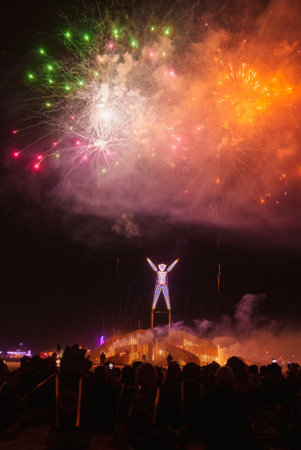 Burning Man Festival Night Scene with Fireworks and The Man Effigyの写真素材