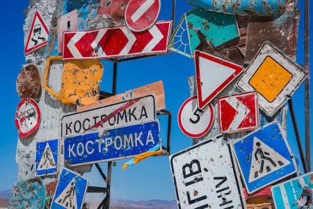 Art Installation of Weathered Road Signs in Desert Settingの写真素材