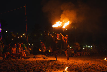 Nighttime Fire Show on a Beach in Phuket or Koh Phi Phi, Thailandの写真素材