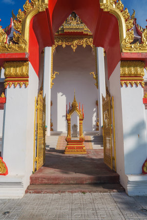 Ornate Thai Temple Entrance with Gold Detailing in Phuket, Thailandの写真素材