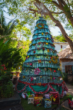 Recycled Plastic Bottle Christmas Tree in Tropical Thailand Settingの写真素材
