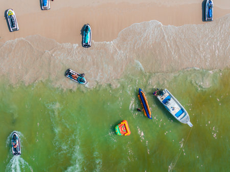Aerial View of a Vibrant Beach with Boats in Phuket, Thailand