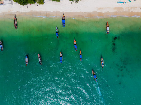 Aerial View of Long Tail Boats Anchored on a Beach in Thailandの写真素材