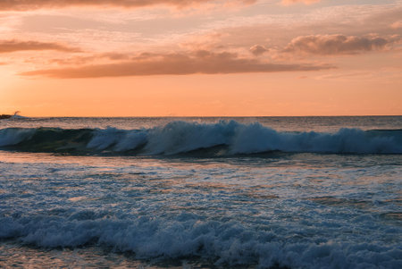 Serene Ocean Sunset with Rolling Waves and Warm Sky Hues