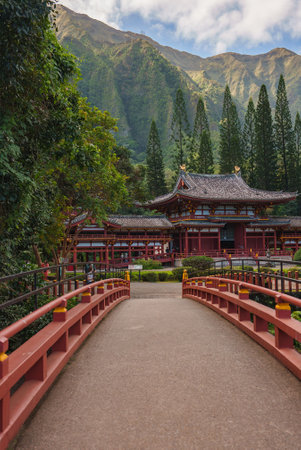 Byodo In Temple with Red Bridge and Lush Greenery in Oahu, Hawaiiの写真素材