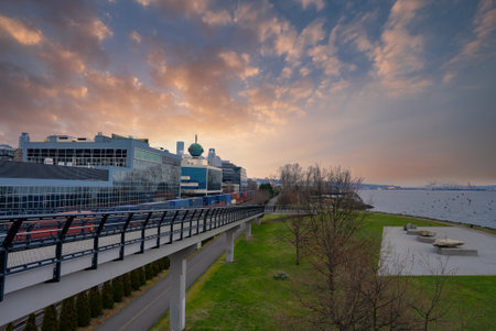 Seattle Waterfront at Sunset with Elevated Walkway and Green Domeの写真素材