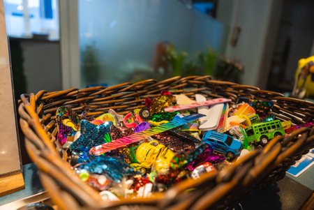 Wicker Basket with Colorful Trinkets in an Interiorの写真素材