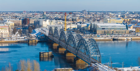 Winter Aerial View of Riga with Railway Bridge and Cityscapeの写真素材