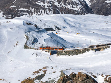 Aerial View of Gornergrat Railway Train in Snowy Zermatt Landscape