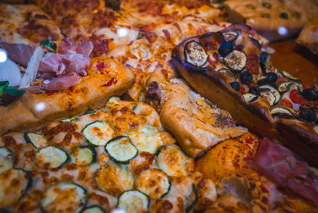 Close Up of Italian Pizzas with Diverse Toppings in Bergamo, Italyの写真素材