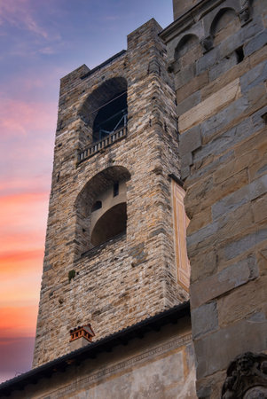 Historic Stone Tower in Bergamo, Italy at Sunsetの写真素材