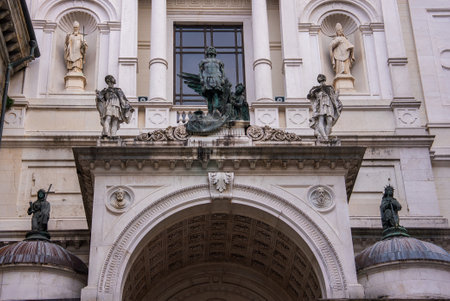 Ornate Architectural Facade with Statues in Bergamo, Italyの写真素材