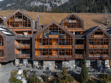 Aerial View of Alpine Hotel in the Dolomites, Italy with Mountain Backdropの写真素材