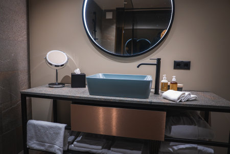 Modern Bathroom Vanity with Blue Sink in South Tyrol Hotelの写真素材