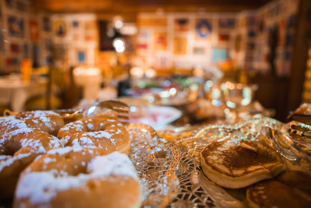 Cozy Dining Area with Pastries in Boutique Hotel, Cortina, Italyの写真素材