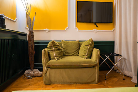 Boutique Hotel Room Interior with Green Armchair in Cortina, Italyの写真素材