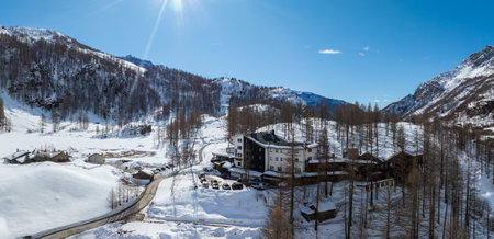 Cozy Hotel in Snowy Alpine Landscape Near Matterhorn Mountainの写真素材