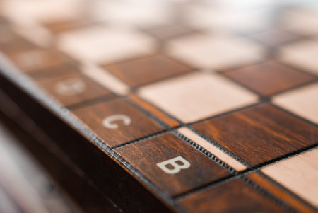 Close Up of a Polished Wooden Chessboard with Grid Markingsの写真素材
