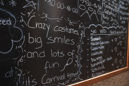 Blackboard with Carnival Theme and Ski Hut Information