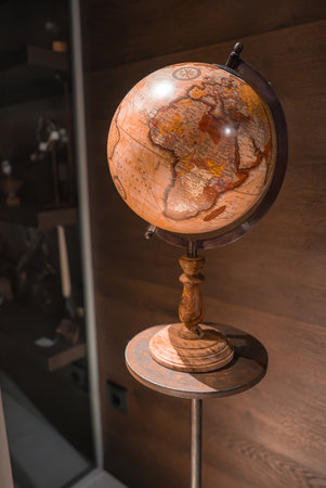 Vintage Globe with Antique Map Design on Wooden Base and Standの写真素材