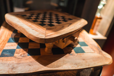 Curved Wooden Chessboard with Drawer in Upscale Interior Settingの写真素材