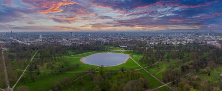 Aerial View of a London Park with Oval Pond and City Skylineの写真素材