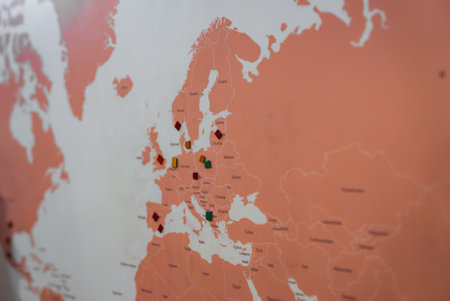 Close Up of a World Map Highlighting Europe with Colored Markersの写真素材