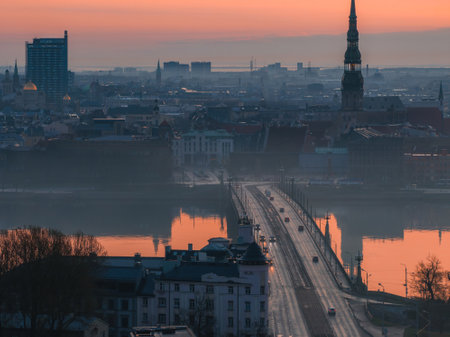 Morning View of Rigas Old Town and St. Peters Church at Sunriseの写真素材