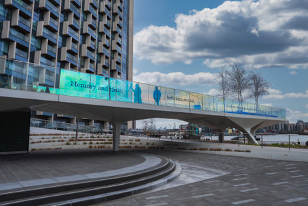 Modern Walkway and Urban Architecture in London with Thames River Viewの写真素材